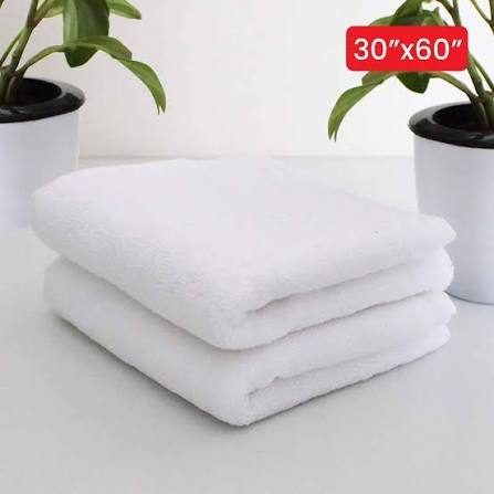 Folded white bath towels
