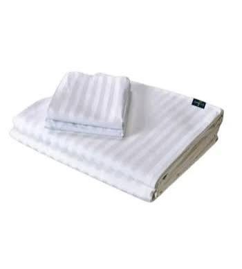 White bed sheets folded stack