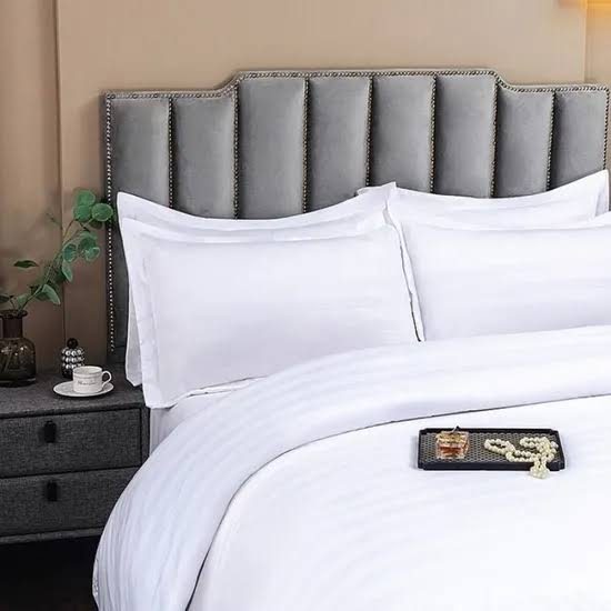 Duvet cover styled on a bed with pillows