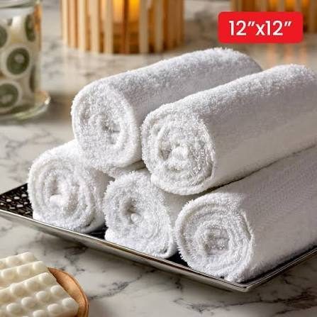 Rolled white face towels