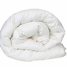 Duvet comforter rolled up showing fluffy fill